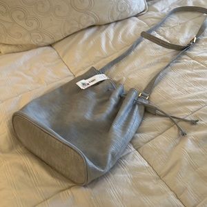 Bloomingdale’s Aqua cinch bag